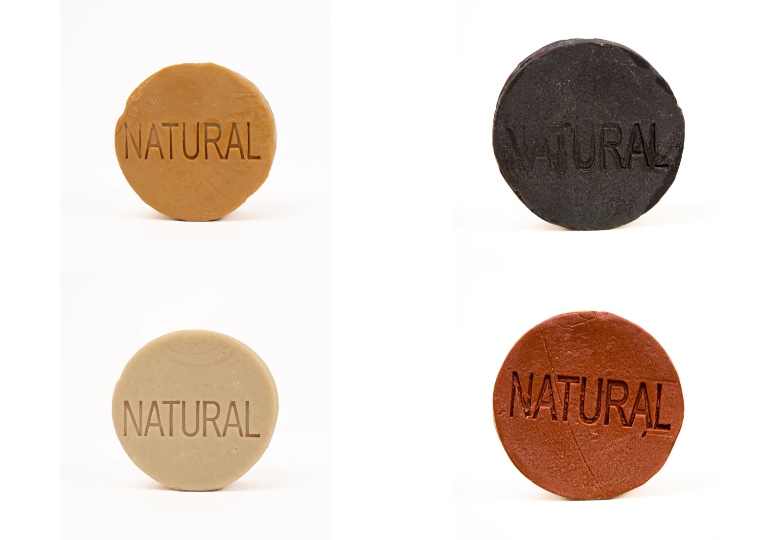 Round solid natural soap bars in clay, charcoal and olive varieties